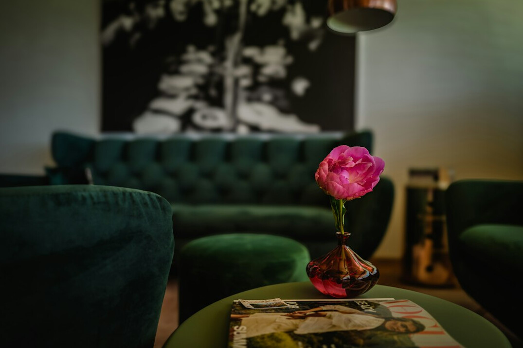 Vintage 1980s-style elegant living room interior with velvet sofa and brass details