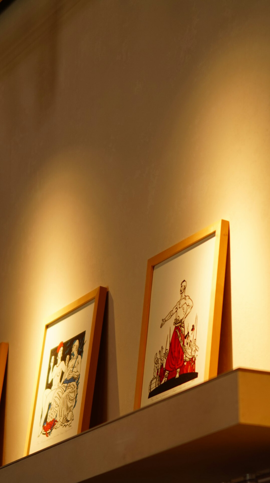 celebrity art collection on wall